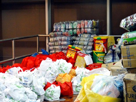 Slippers in plastics, biscuits in cans, bags and boxes of donations as relief goods for typhoon Haiyan victims, at the Philippine Red Cross warehouse.