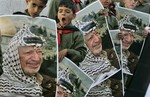 Palestinian boys hold portraits of late leader Yasser Arafat during a ceremony to commemorate the Nakba, or the catastrophe, the Arabic term used to describe the uprooting of hundreds of thousands of Palestinians with the 1948 creation of the state of Israel, in the West Bank village of Beit Anan, near Ramallah, Saturday May 10, 2008. In the West Bank and Gaza, Palestinians staged events to remind the world that Israel's creation as been their "nakba," or catastrophe. Hundreds of thousands were uprooted during the 1948 war over Israel's creation, and some 4.5 million Palestinian refugees and their descendants are scattered across the region toda