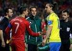 Portugal's Cristiano Ronaldo, left, and Sweden's Zlatan Ibrahimovic shake hands before the World Cup qualifying playoff