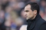 Wigan Athletic's manager Roberto Martinez takes to the touchline before his team's English Premier League soccer match against Tottenham at The DW Stadium, Wigan, England, Saturday April 27, 2013.