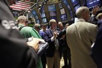 Traders work on the floor of the New York Stock Exchange, Friday, Aug. 7, 2009 in New York