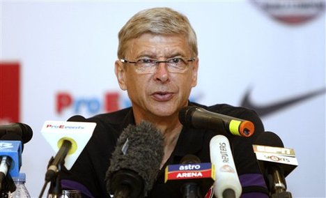 Arsenal's manager Arsene Wenger speaks during a press conference in Kuala Lumpur, Malaysia, Sunday, July 22, 2012. Arsenal will play the Malaysian XI, a Malaysia League selection, on Tuesday as part of their Asia tour.