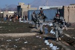 File - Staff Sgt. Henry Baez, of Chicago, Spc. Todd Verstrate, of Kewanee, Ill., as well as other Soldiers of Delta Company Security Forces, 33rd Infantry Brigade Combat Team, conduct a foot patrol in Kabul, Afghanistan.