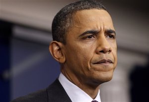 President Barack Obama pauses during a news conference in the James Brady Press Briefing Room of the White House in Washington, Tuesday, March 6, 2012.