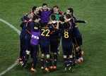 Spanish players celebrate their 1-0 win after the World Cup final soccer match between the Netherlands and Spain at Soccer City in Johannesburg, South Africa, Sunday, July 11, 2010