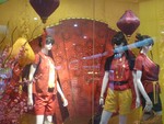 Cheongsam Clothes display on the shop and one the example ready to sell to celebrated coming up Chinese New Year