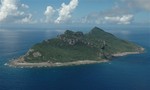 In this photo taken on Sept. 15, 2010, Uotsuri Jima in Japanese and Diaoyu Dao in Chinese, one of main islands among the islets of Senkaku in Japanese and Diaoyu in Chinese, is seen from a patrol aircraft P3C of Japan Maritime Self-Defense Forces as it files over the water in the East China Sea  during a press tour arranged by Japan's Defense Ministry. Chinese and Japanese leaders are not planning any talks next week on the sidelines of the U.N. General Assembly, partly because of escalating tension over a collision by a Chinese fishing boat and two Japanese patrol boats near disputed southern islets claimed by both countries, a top Japanese spokesman said Thursday, Sept. 16, as Tokyo stepped up its presence in the area.