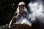 An Aboriginal man prepares to perform the traditional 