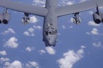 B-52 Stratofortress, 40th Expeditionary Bomb Squadron, displays a national flag as it prepares to be refueled by a KC-135 Stratotanker, 28th Expeditionary Air Refueling Squadron. The bomber&acute;s mission is to provide close air support for coalition tro