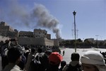 Smoke rises after an explosion at the Defense Ministry complex in Sanaa, Yemen, Thursday, Dec. 5, 2013.