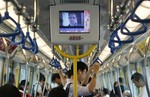 In this June 16, 2013 file photo a television screen shjows the news of Edward Snowden, a former CIA employee who leaked top-secret documents about sweeping U.S. surveillance programs, in the underground train in Hong Kong.