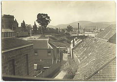 Hobart - Davey Street - corner of Murray Street- looking past Franklin Square to Wharves & IXL building c1900s