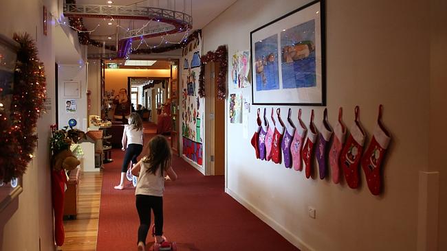 Children zip down the halls of Bear Cottage.