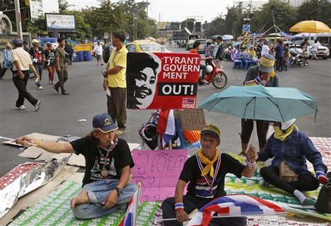 Anti-government protesters camp outside Government house, which houses Thai Prime Minister Yingluck Shinawatra's office, in Bangkok, Thailand , Wednesday, Dec. 11, 2013.