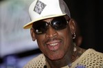 FILE - In this July, 31, 2012, file photo, former NBA basketball player Dennis Rodman appears during a news conference to announce his tour and charity work in Panama City. The American known as “The Worm” is set to arrive Tuesday, Feb. 26, 2013, in Pyongyang, becoming an unlikely ambassador for sports diplomacy at a time of heightened tensions between the U.S. and North Korea.