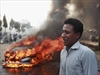 A Bangladeshi man after his vehicle was set on fire by Islamist party