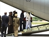 The casket of Nelson Mandela is carried into a military aircraft.