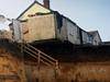 Gran finally leaves house before it falls off cliff