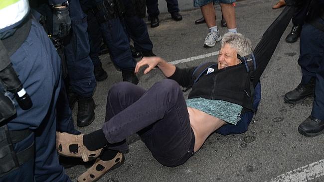 Police remove a protester at the site on the corner of Brunswick St and Westgarth St in Fitzroy. Picture: Nicole Garmston 