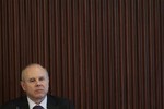 Brazil's Finance Minister Guido Mantega attends a meeting on changes in economic policy at the Planalto presidential palace in Brasilia, Brazil, Thursday, May 3, 2012.