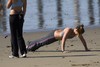 Two-girls-exercising-cayucos-beach1