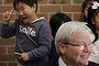 Prime Minister Kevin Rudd is photobombed by a Korean boy on the election campaign on 7 August 2013.