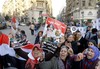 Egyptian activists shout anti-terrorism slogans as they hold posters showing Defense Minister Gen. Abdel-Fattah el-Sissi and late President Gamal Abdel-Nasser, right, with Arabic slogans read, "Egypt is entrusted to us.