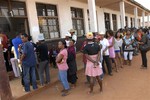 Madagascans line up to cast their votes in a referendum in Antananarivo Wednesday Nov. 17, 2010. Twenty months after Madagascar's president was ousted in a coup by a former disc jockey, voters decided Wednesday whether to accept or reject a new constitution that calls for keeping Andry Rajoelina in power indefinitely.