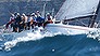 Team members of Midnight Ramble ride the rails as they leave Sydney Harbour just after the start of the Sydney to Hobart yacht race Thursday, Dec. 26, 2013. Race officials are warning the fleet to expect gale-force winds and waves of up to 12 meters (40 feet) during the race that covers 628 nautical miles, or 1,163 kilometers (723 miles). (AP Photo/Rick Rycroft)