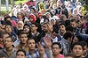 Cairo University students supporting the Muslim Brotherhood and deposed President Mohamed Mursi, gesture the 