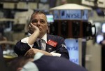 Trader Albert Young works from the floor of the New York Stock Exchange, Tuesday, April 27, 2010, in New York