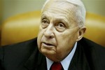 FILE -- In this Sunday Jan. 30, 2005 file photo, Israeli Prime Minister Ariel Sharon pauses during the weekly cabinet meeting in his Jerusalem office.