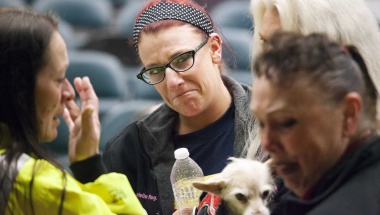 Union member Gabrielle Rogano (C) reacts with fellow union members after hearing that a union vote narrowly passed by 51% in support of Boeing's contract with the International Association of Machinists and Aerospace Workers (IAM) District Lodge 751 to construct the wings for the 777X jetliner in Seattle, Washington January 3, 2014.  REUTERS/David Ryder  