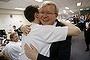 Prime Minister Kevin Rudd is embraced by his youngest son Marcus who is working in the ALP Campaign HQ in Melbourne on Friday 9 August 2013.