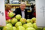 Prime Minister Kevin Rudd stacks the shelves after he delivered fruit to Abu Hussein mixed business in South Granville, Sydney on 23 August 2013. Election 2013.