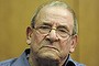 FILE - In this Oct. 28, 2009 file photo  Heinrich Boere, a former member of Adolf Hitler's Waffen SS, sits in the dock of a court at the start of his trial in Aachen, Germany.  German justice officials said Monday, Dec. 2, 2013 Heinrich Boere, who murdered Dutch civilians as part of a Nazi Waffen SS hit squad during World War II but avoided justice for six decades, has died in a prison hospital. He was 92.  (AP Photo/Martin Meissner, File)