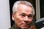 FILE- In this Wednesday, Oct. 29, 1997 file photo Mikhail Kalashnikov shows a model of his world-famous AK-47 assault rifle at home in the Ural Mountain city of Izhevsk, 1000 km (625 miles) east of Moscow, Russia. Kalashnikov, whose work as a weapons designer for the Soviet Union is immortalized in the name of the world?s most popular firearm, died Monday at the age of 94 in a hospital of the city of Izhevsk where he lived. The AK-47 has been favored by guerrillas, terrorists and the soldiers of many armies. An estimated 100 million guns are spread worldwide.  (AP Photo/Vladimir Vyatkin, File)