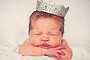 newborn baby wearing crown