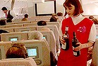 Alcohol being served on plane by flight attendant