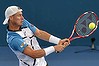 BRISBANE, AUSTRALIA - JANUARY 05: Lleyton Hewitt of Australia plays a backhand in his finals match against Roger Federer of Switzerland during day eight of the 2014 Brisbane International at Queensland Tennis Centre on January 5, 2014 in Brisbane, Australia.  (Photo by Bradley Kanaris/Getty Images)