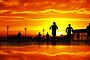 Sunrise over Sydney from the front of the Sydney Opera House with joggers enjoying the morning light.