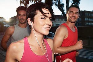 Female runner at evening run with friends