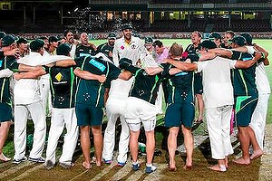 SYDNEY, AUSTRALIA - JANUARY 05:  Nathan Lyon of Australia leads the team song on the pitch at midnight after day three of the Fifth Ashes Test match between Australia and England at Sydney Cricket Ground on January 5, 2014 in Sydney, Australia.  (Photo by Ryan Pierse/Getty Images)