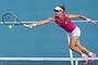 Sam Stosur plays a forehand volley in her first-round match against Madison Brengle of the US.