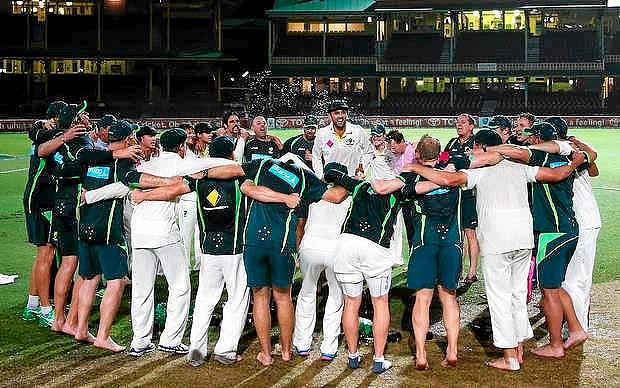 SYDNEY, AUSTRALIA - JANUARY 05: Nathan Lyon of Australia leads the team song on the pitch at midnight after day three of the Fifth Ashes Test match between Australia and England at Sydney Cricket Ground on January 5, 2014 in Sydney, Australia. (Photo by Ryan Pierse/Getty Images)