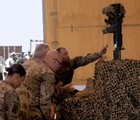 File - U.S. Army Soldiers and civilians, assigned to 2/10 Security Forces Assistance Brigade, pay final respects to fallen comrades, Lt. Col. Todd Clark, Lt. Col. Jaimie Leonard and Law Enforcement Professional Joseph Morabito during a memorial ceremony at Forward Operating Base Sharana, Afghanistan, June 13, 2013.