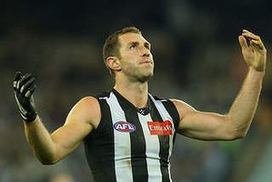 MELBOURNE, AUSTRALIA - JULY 12:  Travis Cloke of the Magpies reacts after missing a goal during the round 16 AFL match between the Collingwood Magpies and the Adelaide Crows at Melbourne Cricket Ground on July 12, 2013 in Melbourne, Australia.  (Photo by Michael Dodge/Getty Images)