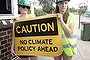 Protestors wait for Opposition Leader Tony Abbott during his visit to Penrice Soda Holdings in Port Adelaide, on Tuesday 3 September 2013.