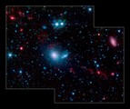 2005/12/01 Dwarf Galaxies Swimming in Tidal Tails - This false-color infrared image from NASA&acute;s Spitzer Space Telescope shows  little &quot;dwarf galaxies&quot; forming in the &quot;tails&quot; of two larger galaxies that  are colliding together. Th