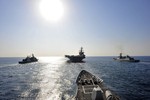 EAST CHINA SEA (Jan. 14, 2011) USS Bunker Hill trails behind USS Carl Vinson and two Korean ships.